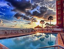sky, water, outdoor, cloud, palm tree, swimming pool, text, tree, lake